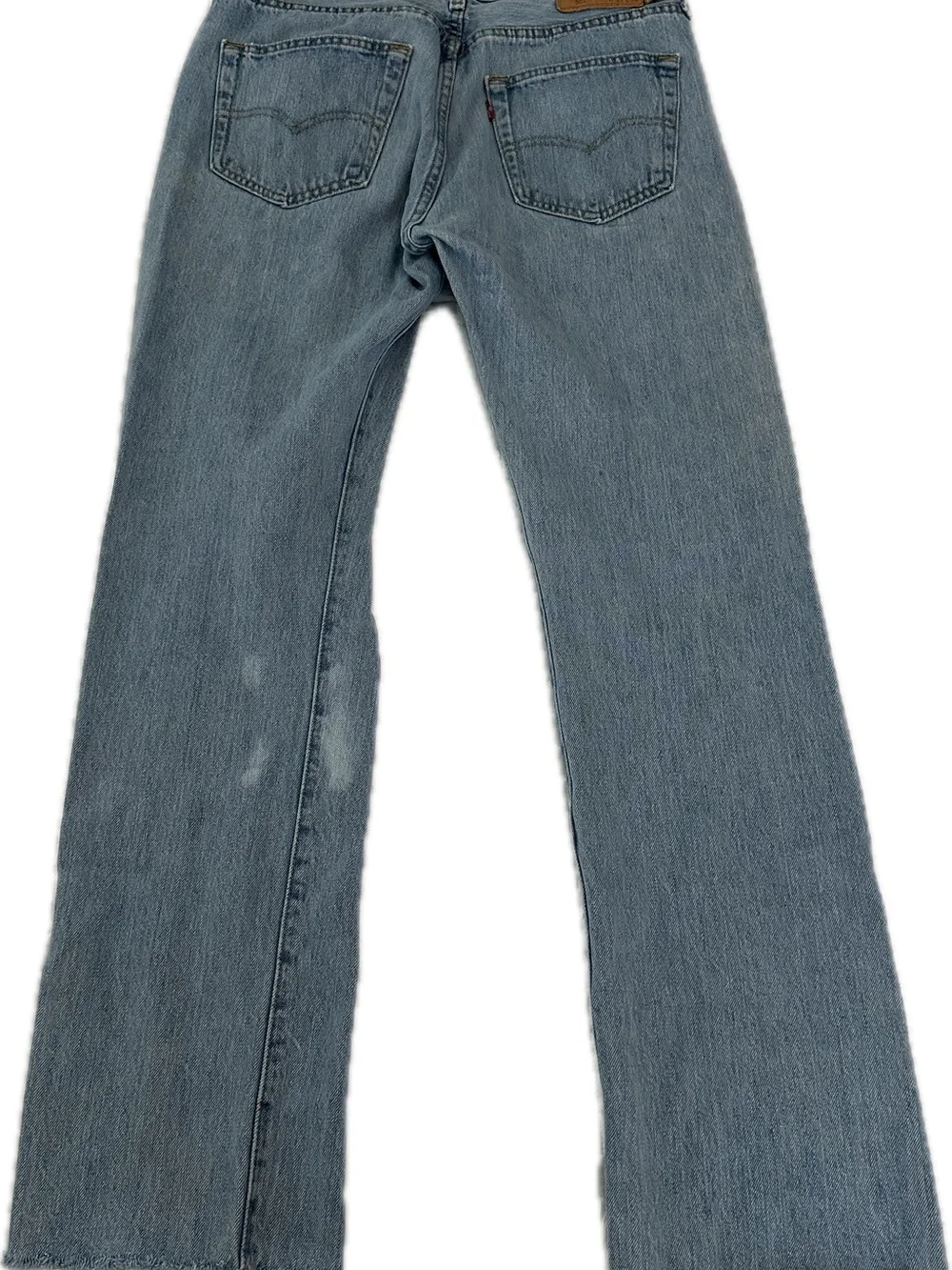 Levi's 501 blue jeans with distressed knees